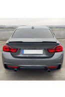 The M4 ducktail style rear trunk wing spoiler for BMW 4 Series F32 Coupe 2-door models (2014-2020) is custom-molded to match lower trunk lid contours with OEM precision. Manufactured from high-grade, flexible ABS plastic with a factory high-gloss Piano Black finish, this aggressive rear wing requires no additional sanding or painting. Unlike brittle fiberglass options, it provides high impact resistance, UV protection, and weather durability. 