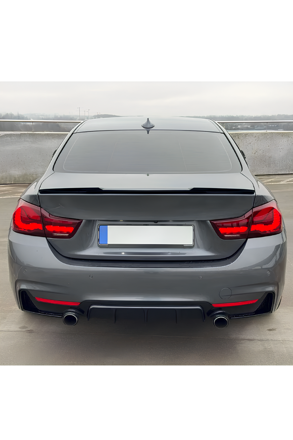 The M4 ducktail style rear trunk wing spoiler for BMW 4 Series F32 Coupe 2-door models (2014-2020) is custom-molded to match lower trunk lid contours with OEM precision. Manufactured from high-grade, flexible ABS plastic with a factory high-gloss Piano Black finish, this aggressive rear wing requires no additional sanding or painting. Unlike brittle fiberglass options, it provides high impact resistance, UV protection, and weather durability. 