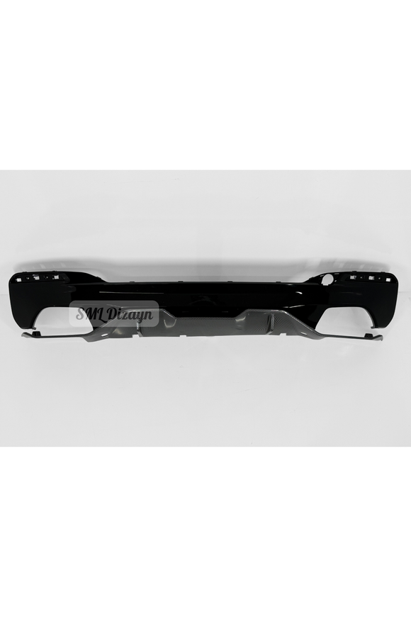 The 2-piece M Performance style carbon detail rear bumper diffuser set for BMW 5 Series G30 Sedan models (2017-2023 with M Sport bumper) is custom-molded to fit OEM rear bumper cutouts with exact precision. Featuring a high-gloss Piano Black main body and a center hydrographic 3D carbon fiber pattern lip, this 2-tone diffuser adds aggressive downforce styling and depth. Manufactured from high-grade flexible ABS plastic, it provides impact resistance, heat resistance against exhaust gases